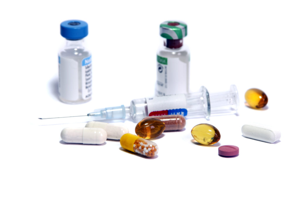 syringe and medicine bottles as symbol of doping